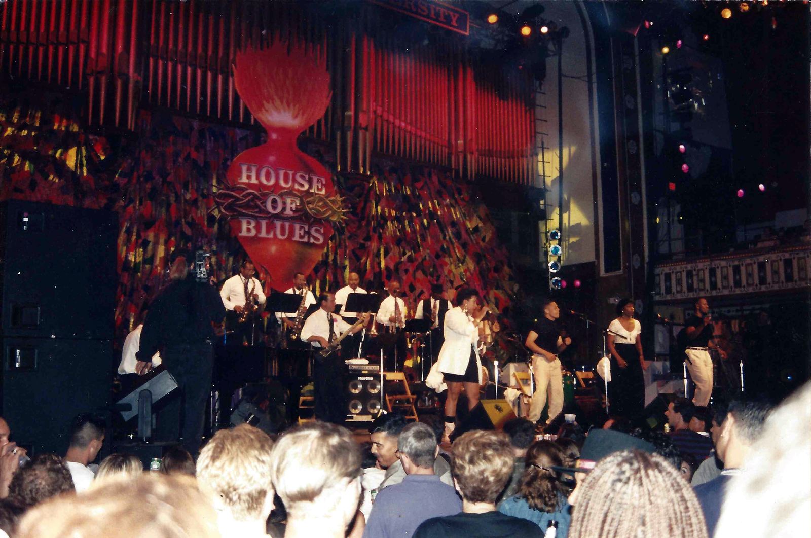Tito Puente's orchestra performs on a stage in front of a crowd in Atlanta